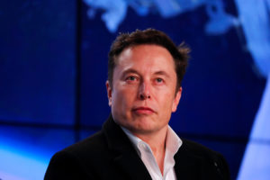 Musk looks on at SpaceX Falcon 9 post-launch news conference in Cape Canaveral