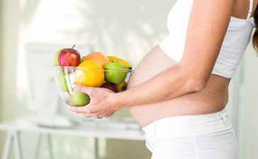 pregnant-woman-holding-bowl-of-fruit
