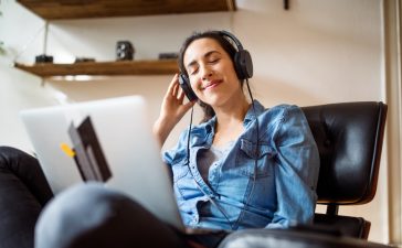 Woman enjoying listening online music